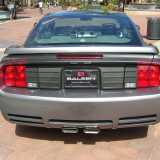 Saleen is an auto parts store for people with deep pockets. (It is also a t-shirt and baseball cap shop for people with shallower pockets.) Their specialty is to modify Mustangs - give them a new gearbox, add a supercharger, racing seats and so on. Their motto - as can be seen here on this Mustang parked right smack in the middle of the Spectrum - is "Power in the hands of a few".
