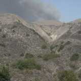 Smoke from the fire before it crests the ridge. Compare to next picture.