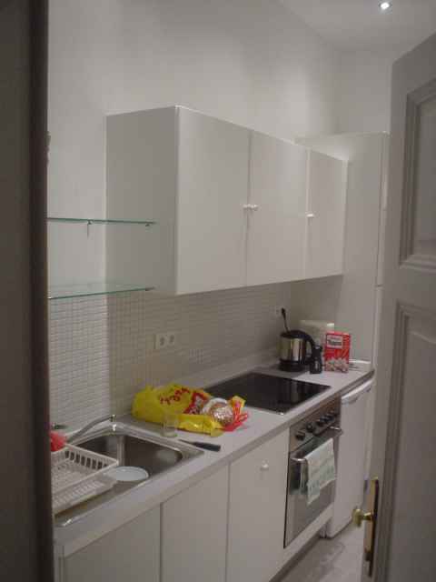 The outer door opens into the kitchen.