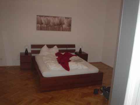 The door to the right in the living room leads to the bedroom.