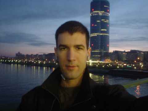 Me, on the Donaupromenad, a walkway along the bridge from the south bank of the Danube to the elongated island in the middle of the Danube (Donauinsel), with the Danube in the background.