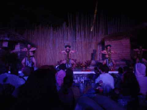 While the women do the "rolling hips", the men do a dance similar to a Maori war dance, if you've seen that.