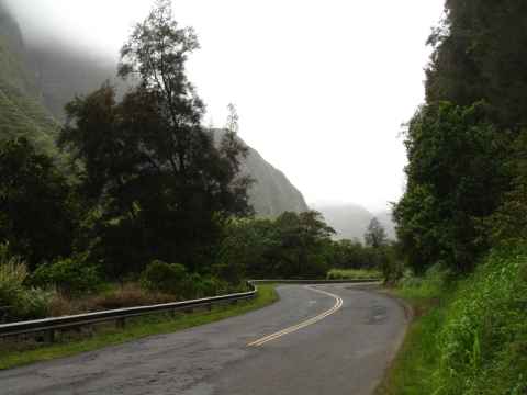 Winding road between steep cliffs.