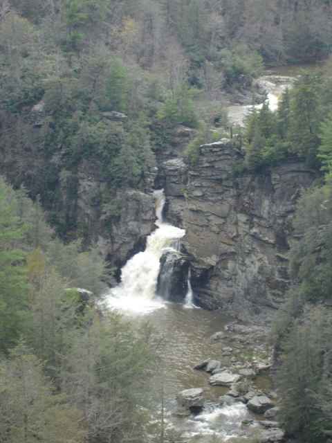 Linville Falls. The water is usually clear, but rainfall had brought with it soil, making the waters muddy. In addition, the stream was also about three times the size it would have been on a dry day. Linville Falls. The water is usually clear, but rainfall had brought with it soil, making the waters muddy. In addition, the stream was also about three times the size it would have been on a dry day.