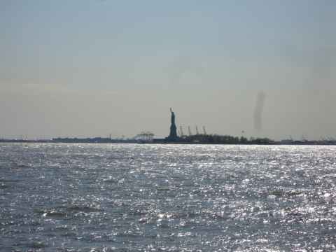 The statue of liberty. The vertical smudge to the right in the image is caused by lens damage.