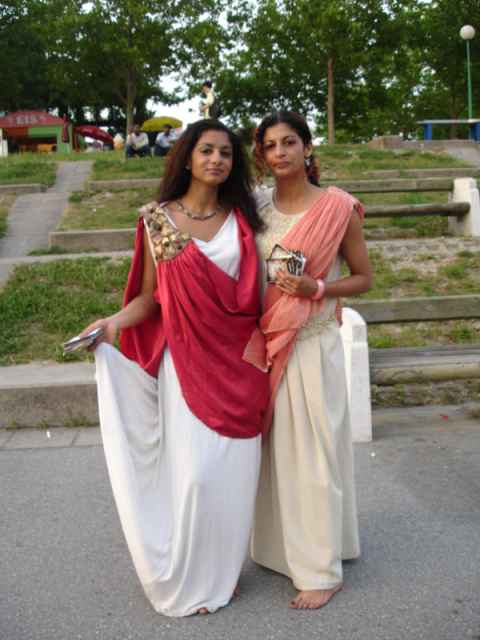 These two toga-clad women were handing out flyers for the new opening of the floating Caesars Palace nightclub. These two toga-clad women were handing out flyers for the new opening of the floating Caesars Palace nightclub.