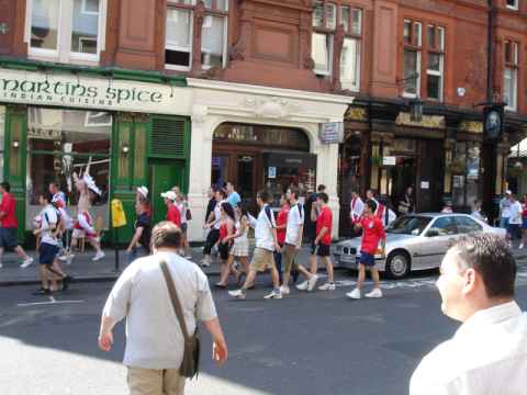 Fans charge up for the England - Portugal game.