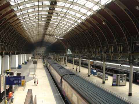 The international rail platforms of Paddington Station. Look at the ceiling near the far end for a demonstration of what a couple hundred years of diesel and coal powered locomotives does with the paint job. The international rail platforms of Paddington Station. Look at the ceiling near the far end for a demonstration of what a couple hundred years of diesel and coal powered locomotives does with the paint job.
