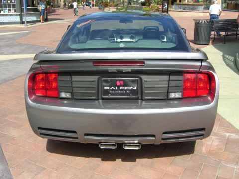 Saleen is an auto parts store for people with deep pockets. (It is also a t-shirt and baseball cap shop for people with shallower pockets.) Their specialty is to modify Mustangs - give them a new gearbox, add a supercharger, racing seats and so on. Their motto - as can be seen here on this Mustang parked right smack in the middle of the Spectrum - is "Power in the hands of a few". Saleen is an auto parts store for people with deep pockets. (It is also a t-shirt and baseball cap shop for people with shallower pockets.) Their specialty is to modify Mustangs - give them a new gearbox, add a supercharger, racing seats and so on. Their motto - as can be seen here on this Mustang parked right smack in the middle of the Spectrum - is "Power in the hands of a few".