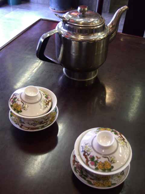 This is what is served: One cup for each sort of tea that you have ordered, and a kettle of hot water. The tea leaves are already in the cups. This is what is served: One cup for each sort of tea that you have ordered, and a kettle of hot water. The tea leaves are already in the cups.