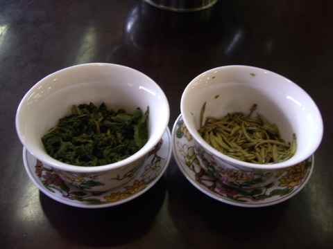 My two teas - the left one is "Monkey Picked Tieguanyin" and the right one is "Silver Needles". You start off by soaking the leaves in a splash of water and smelling them. Then you fill the cup with water and use the lid to push the leaves around, squeeze them against the side of the cup and push them into the water. (The people working there will give you a quick rundown on how to do this.) My two teas - the left one is "Monkey Picked Tieguanyin" and the right one is "Silver Needles". You start off by soaking the leaves in a splash of water and smelling them. Then you fill the cup with water and use the lid to push the leaves around, squeeze them against the side of the cup and push them into the water. (The people working there will give you a quick rundown on how to do this.)