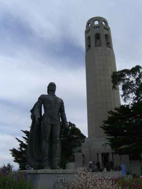 View of the tower with the statue of Christopher Columbus in front. View of the tower with the statue of Christopher Columbus in front.