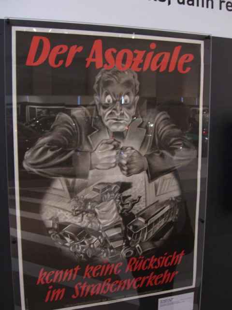 Government poster. "The anti-social has no consideration in street traffic." Fun fact: The word "anti-social" is the same word used by the Nazis to denote "enemies of the people". Government poster. "The anti-social has no consideration in street traffic." Fun fact: The word "anti-social" is the same word used by the Nazis to denote "enemies of the people".
