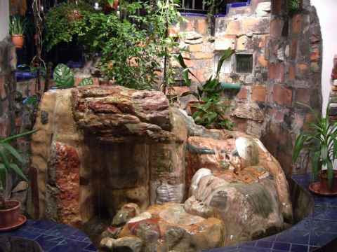 This water-spiral is found in the lobby. The water is pumped upwards along the spiral to fall from it's peak at the center. Similarly, the stairwell is built so that the spiralling stairs are centered above the water-spiral (although the stairs twist in the opposite direction going up). This water-spiral is found in the lobby. The water is pumped upwards along the spiral to fall from it's peak at the center. Similarly, the stairwell is built so that the spiralling stairs are centered above the water-spiral (although the stairs twist in the opposite direction going up).